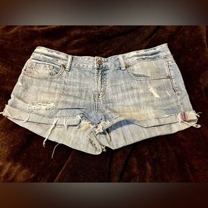 Size 10 VS Pink cutoff denim shorts in light wash.
